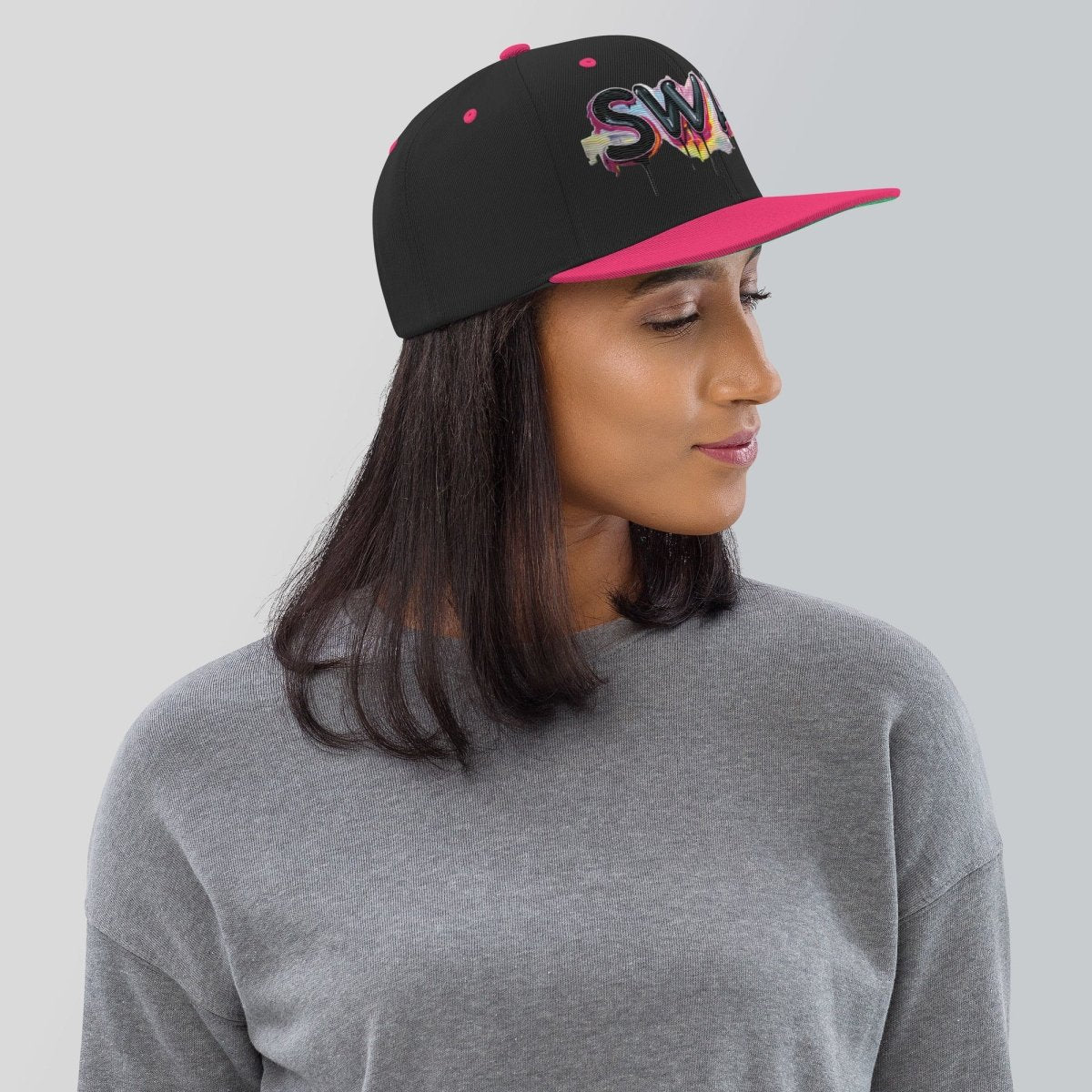 SWA9 Graffiti Pink Snapback Baseball Cap featuring a vibrant graffiti design and the SWA9 logo. This flat brim hat design is perfect for snapback hats for men, baseball caps for men, baseball caps for women, and custom baseball caps enthusiasts. Ideal for those who love flat brimmed hats and mens flat brim hats.